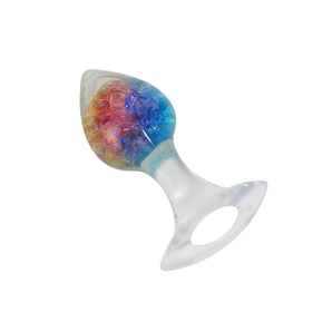Jeweled anal plug featuring shimmering rainbow centerpiece and ergonomic clear handle.