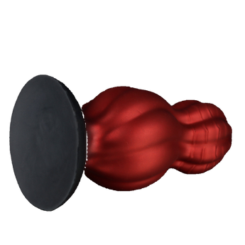 Artistic anal plug in flame-red silicone with vertical ridges and black ergonomic base.