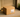 Plain unmarked cardboard delivery box on a doorstep in soft afternoon light, symbolizing discreet shipping and privacy for adult product delivery