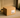 Plain unmarked cardboard delivery box on a doorstep in soft afternoon light, symbolizing discreet shipping and privacy for adult product delivery