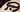 Unfastened generic mouth-gag accessory with a soft signal ball on a neutral surface
