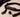 Unfastened generic mouth-gag accessory with a soft signal ball on a neutral surface