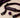 Unfastened generic mouth-gag accessory with a soft signal ball on a neutral surface